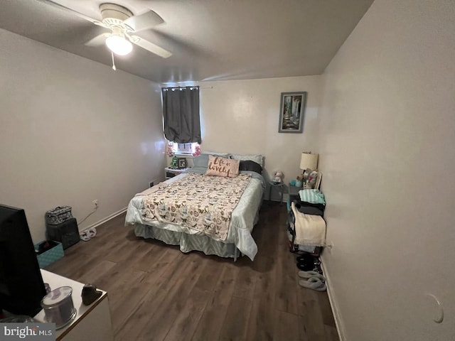 bedroom featuring ceiling fan and dark hardwood / wood-style floors