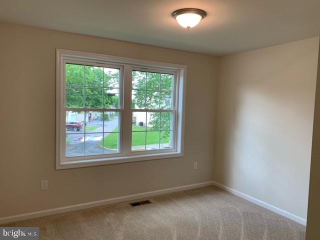 spare room with carpet flooring