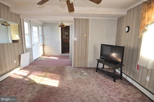 carpeted living room with ornamental molding, a baseboard heating unit, and ceiling fan