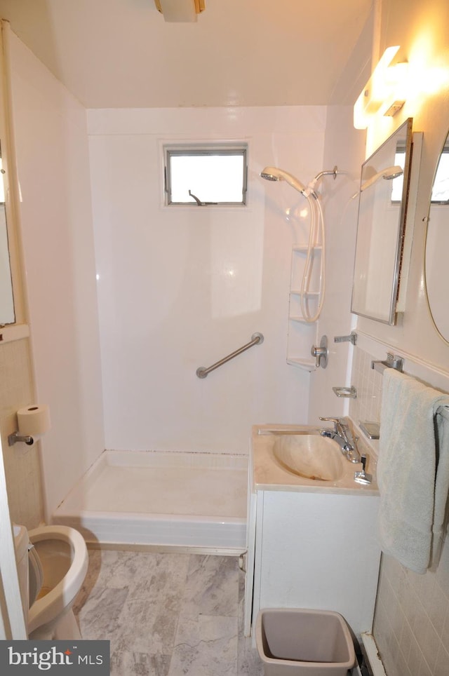 bathroom featuring vanity, toilet, and tile patterned floors