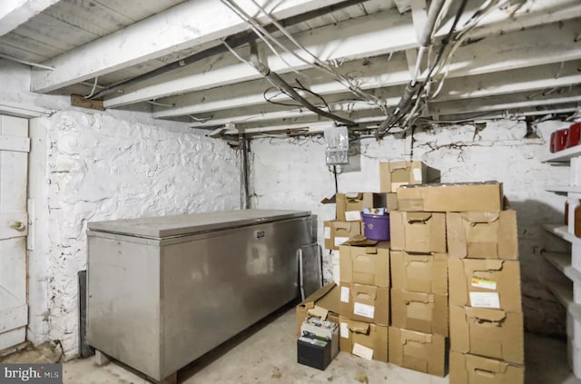 basement with refrigerator