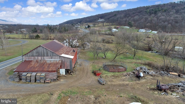 birds eye view of property featuring a mountain view and a rural view