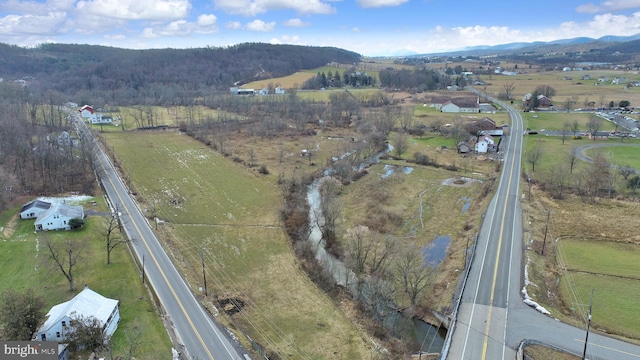 aerial view with a mountain view and a rural view