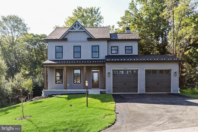 view of front facade with a front lawn and covered porch