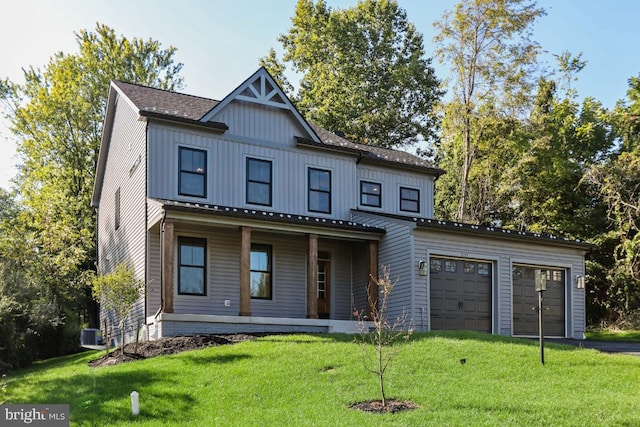 view of front facade with a porch, a garage, a front yard, and cooling unit