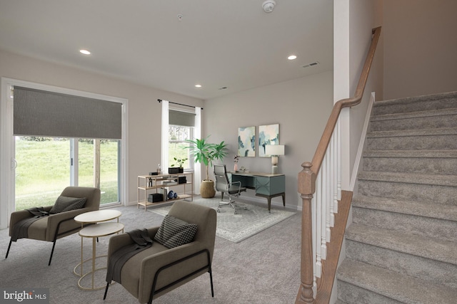 living room with light colored carpet