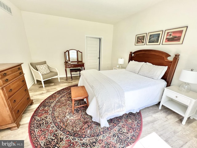 bedroom with light hardwood / wood-style flooring