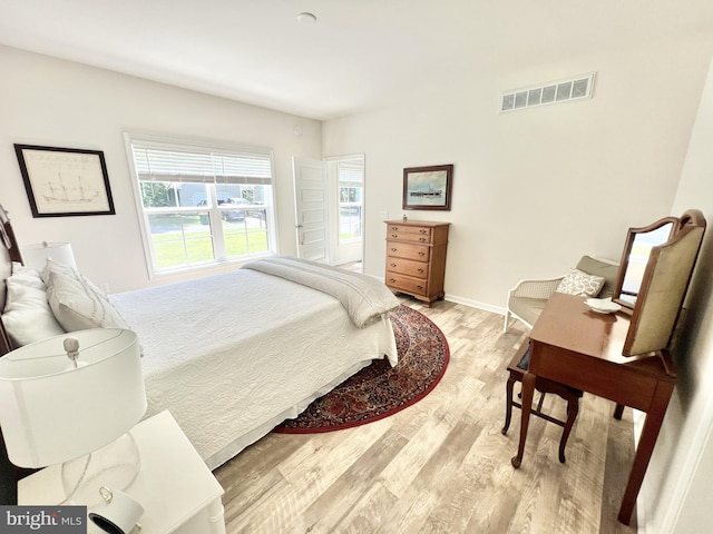 bedroom with light hardwood / wood-style flooring