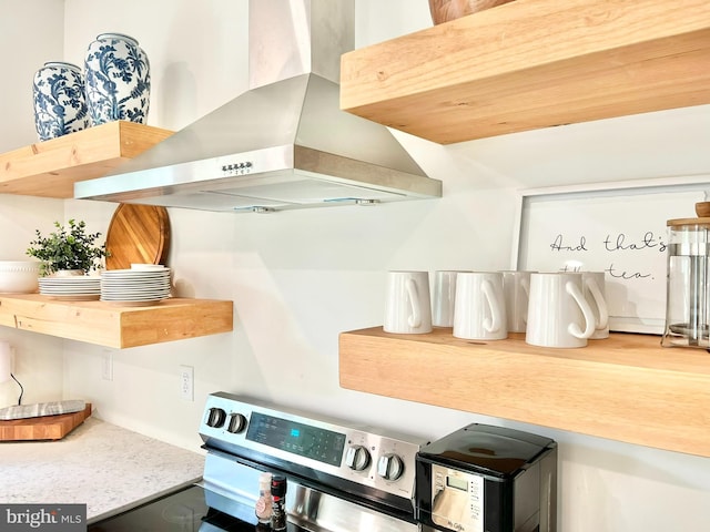 kitchen featuring range and extractor fan