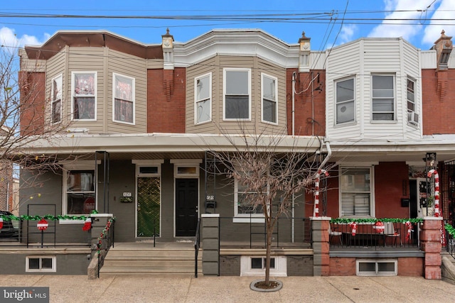 multi unit property featuring cooling unit and covered porch