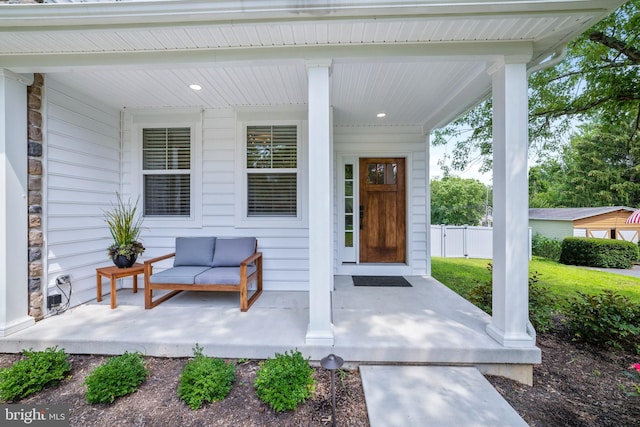 property entrance with covered porch