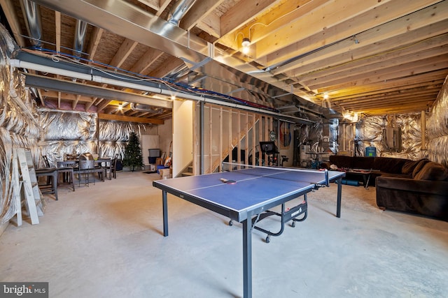 playroom featuring electric panel and concrete floors