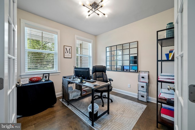 home office featuring dark hardwood / wood-style floors and a chandelier