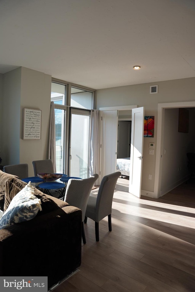 interior space featuring floor to ceiling windows and wood-type flooring