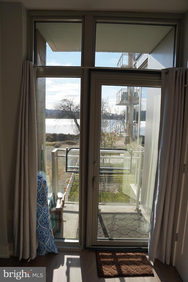 entryway featuring a water view