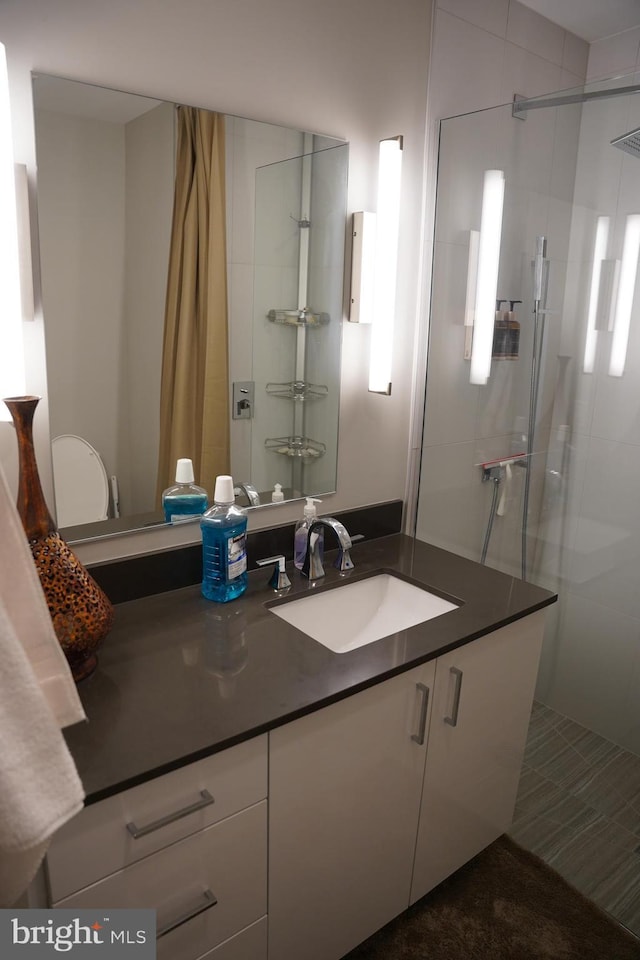 bathroom with vanity and walk in shower