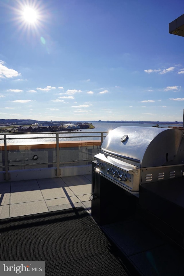 view of patio featuring a water view