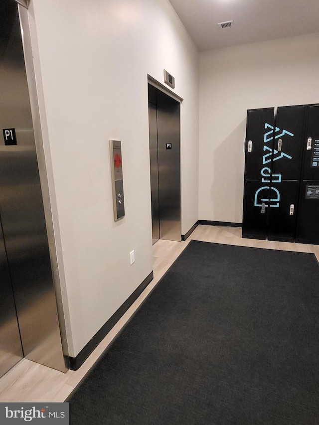 hallway featuring elevator