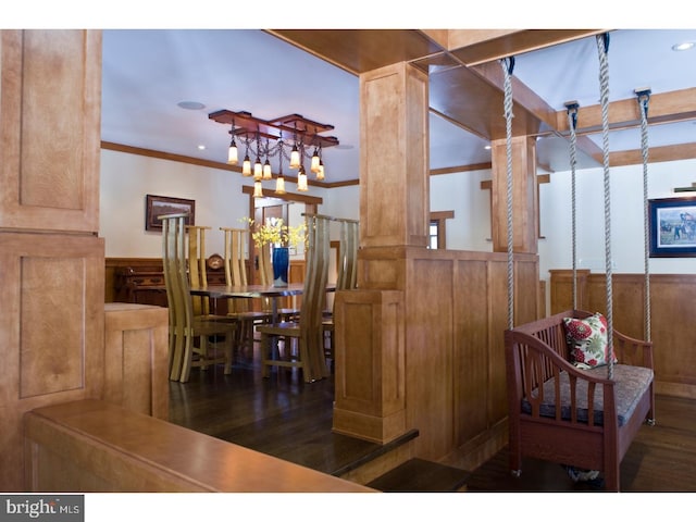 interior space with dark hardwood / wood-style flooring, a chandelier, and ornamental molding