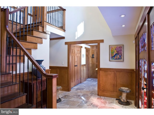 entrance foyer featuring wooden walls