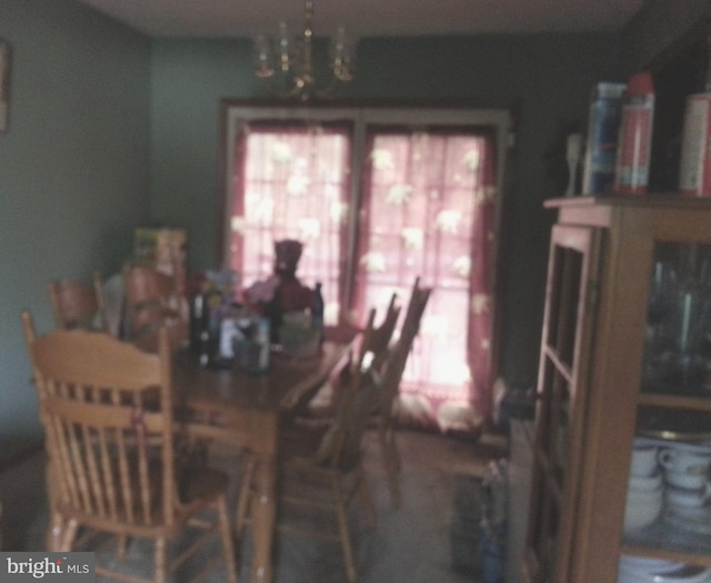 dining room with a chandelier and plenty of natural light