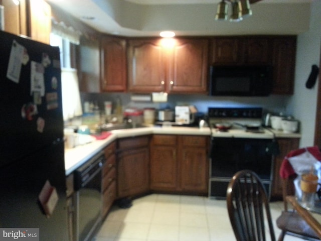 kitchen with sink and black appliances