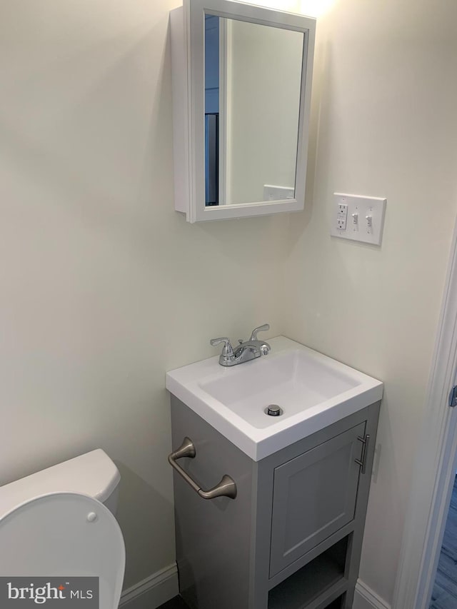 bathroom with vanity and toilet