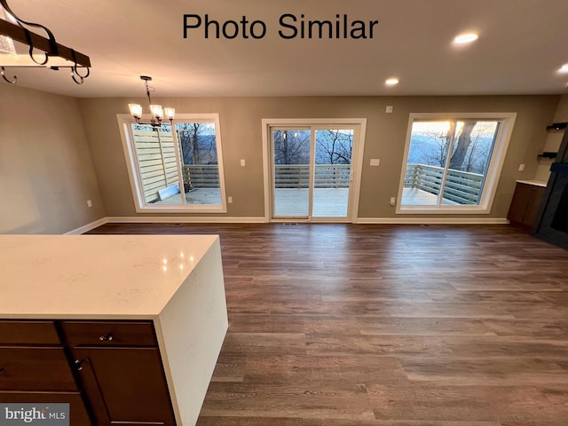 interior space featuring dark hardwood / wood-style floors and a notable chandelier