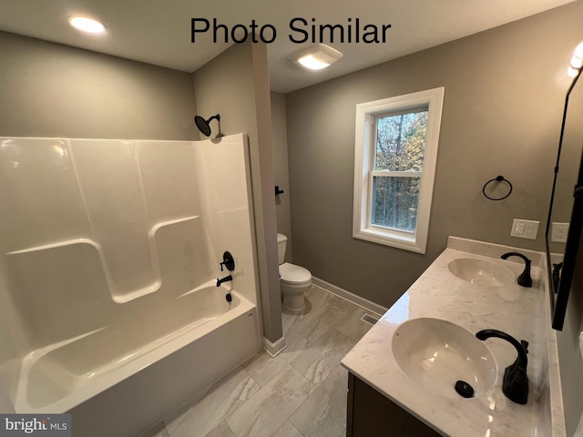 full bathroom featuring vanity,  shower combination, and toilet