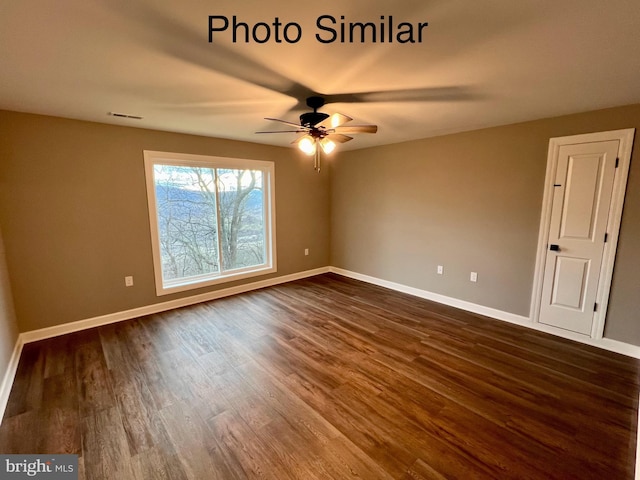 empty room featuring dark hardwood / wood-style flooring and ceiling fan