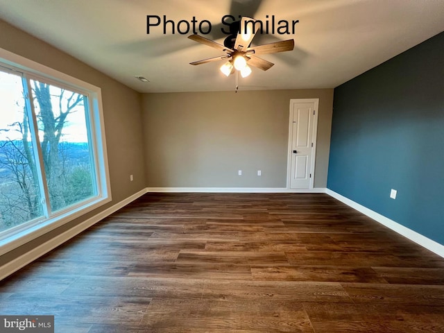 unfurnished room with ceiling fan, plenty of natural light, and dark wood-type flooring