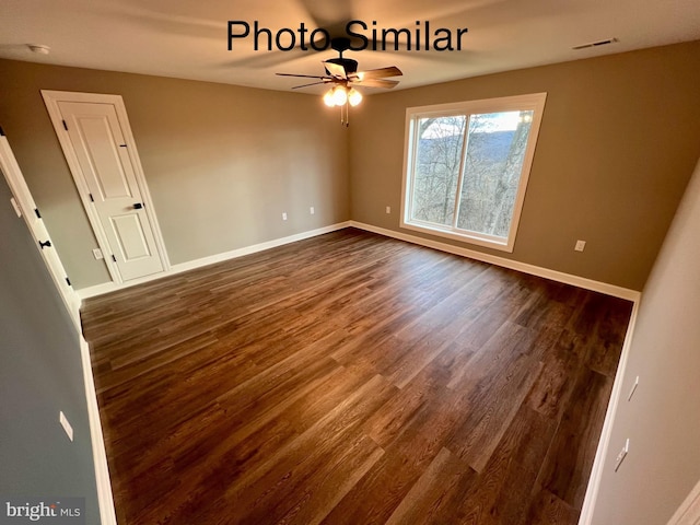 unfurnished room featuring ceiling fan and dark hardwood / wood-style floors