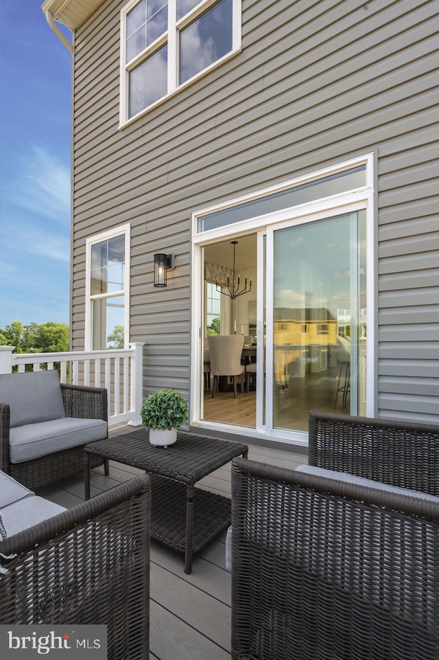 wooden terrace with outdoor lounge area