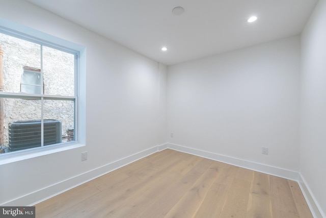 unfurnished room with light hardwood / wood-style floors