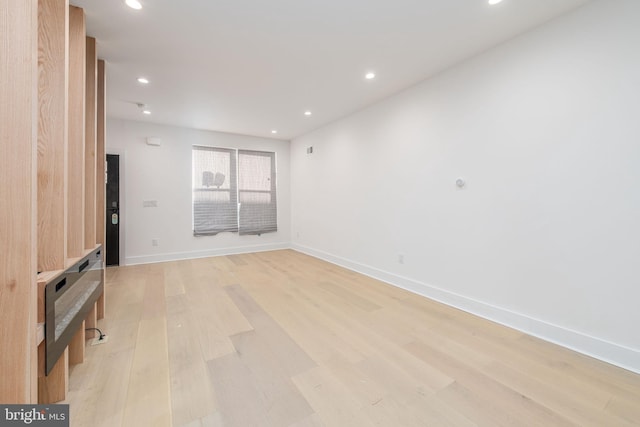 unfurnished living room featuring light hardwood / wood-style flooring