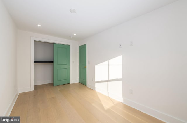 empty room with wood-type flooring