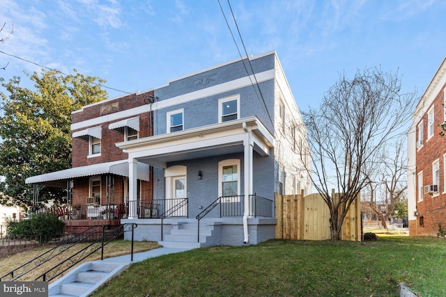 view of front of house featuring a porch and a front yard