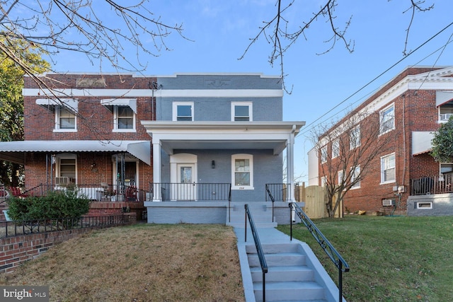 view of front of house featuring a porch and a front yard