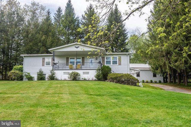 view of front of house featuring covered porch and a front lawn