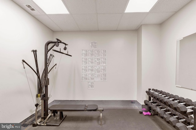 exercise area featuring a drop ceiling