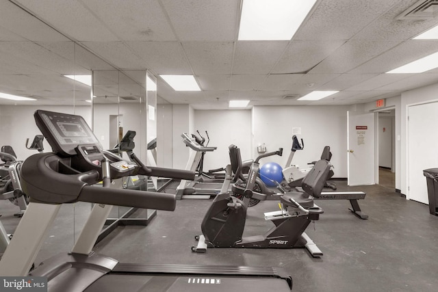 exercise room featuring a drop ceiling