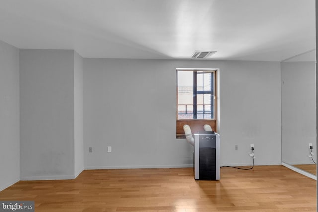 empty room with light wood-type flooring