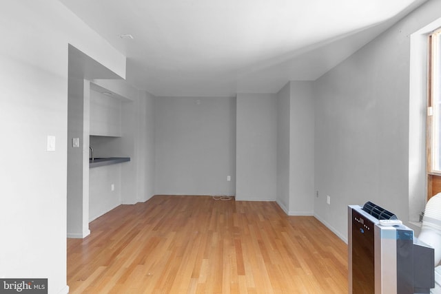 unfurnished living room featuring light hardwood / wood-style floors