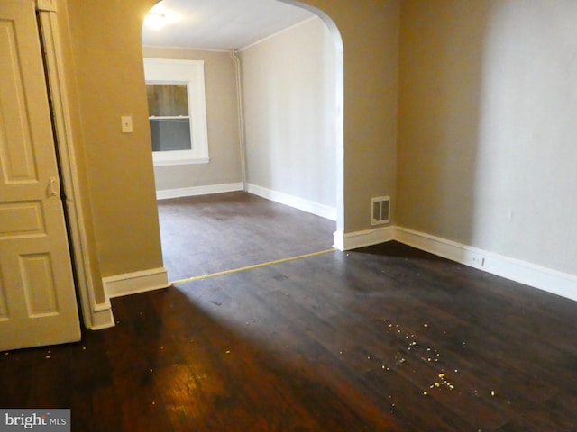 spare room with dark hardwood / wood-style flooring