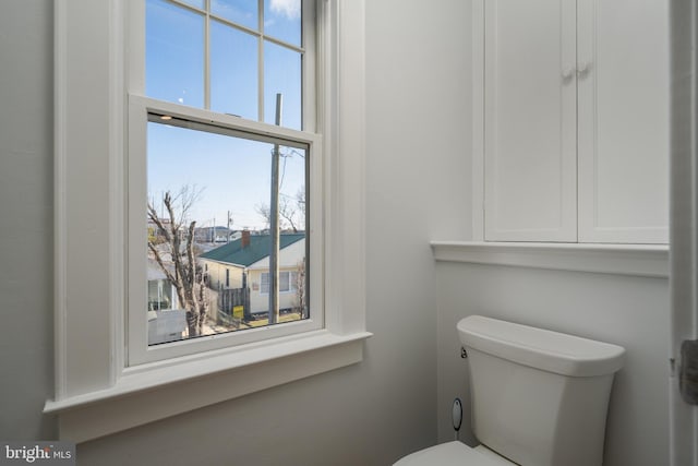 bathroom featuring toilet and a wealth of natural light