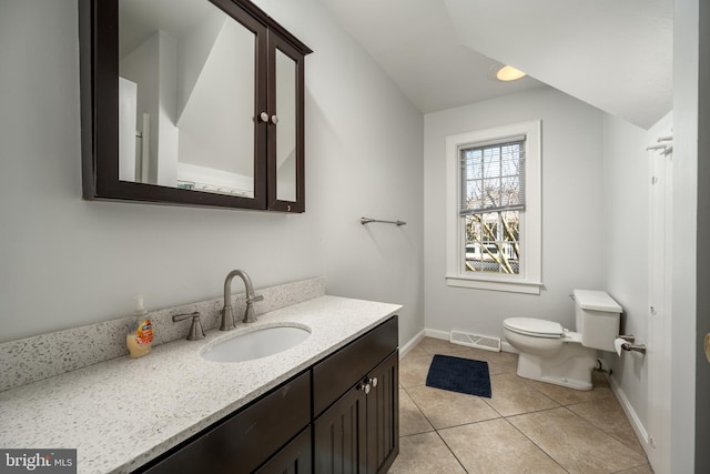 bathroom featuring tile patterned floors, vanity, and toilet