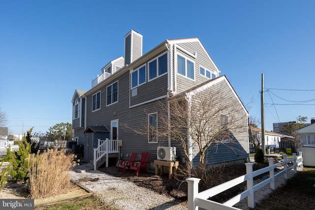 back of house featuring ac unit