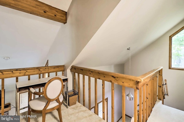 staircase featuring lofted ceiling with beams