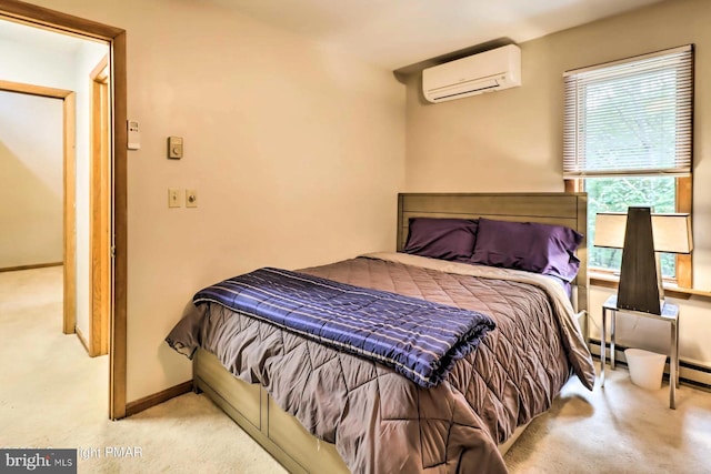 bedroom with a wall mounted AC and light carpet