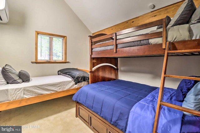 carpeted bedroom with vaulted ceiling and a wall mounted AC